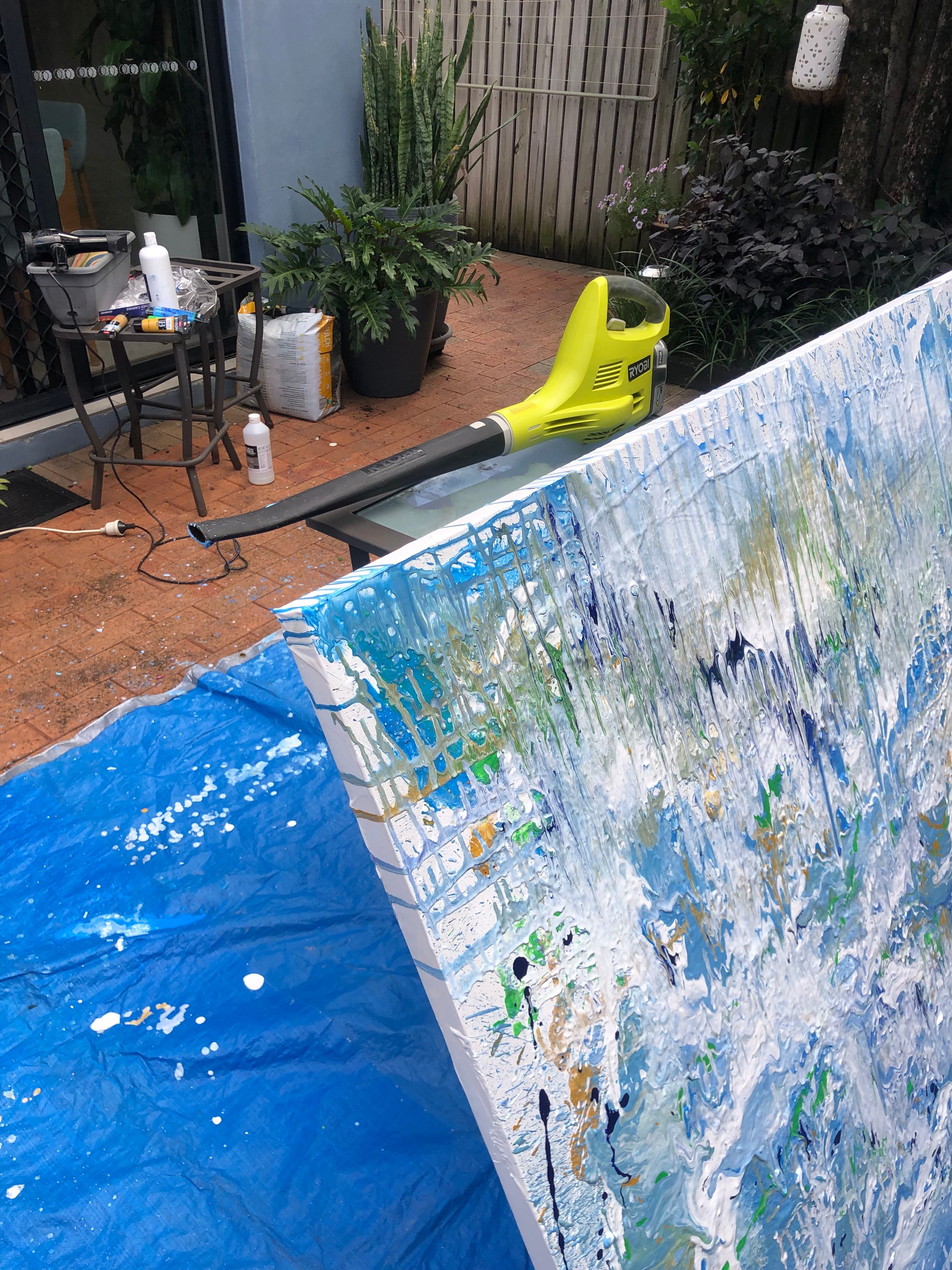 Normally use a hair dryer to move and shape the paint in the canvas, but this canvas was so big I need the blower. I’m hoping if I win the prize pack includes something to clean the paint off the pavers 🤣