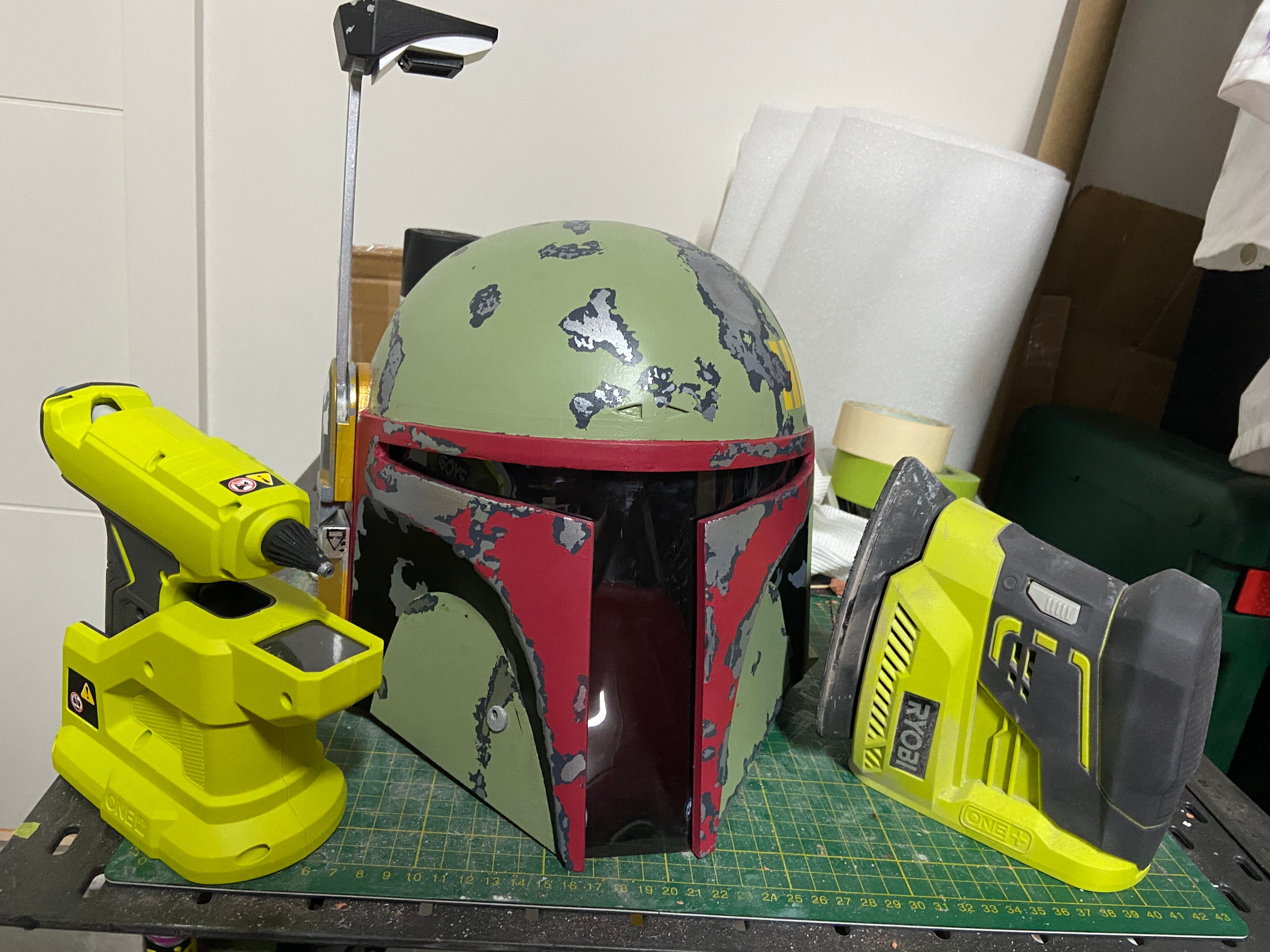 3D printed Boba Fett helmet. The ryobi corner sander was excellent as it allowed me to sand the tight areas within the visor and the overall helmet. The Ryobi hot glue, due to its size was excellent for gluing the visor within the helmet.